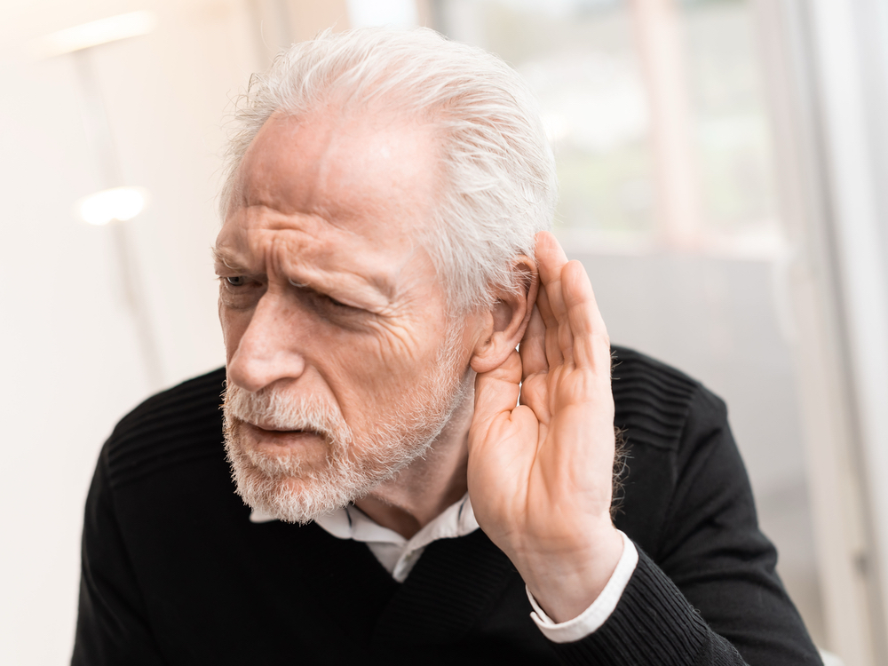 Patient learning about sensorineural and conductive hearing loss at The Hearing Place in Falconer, NY
