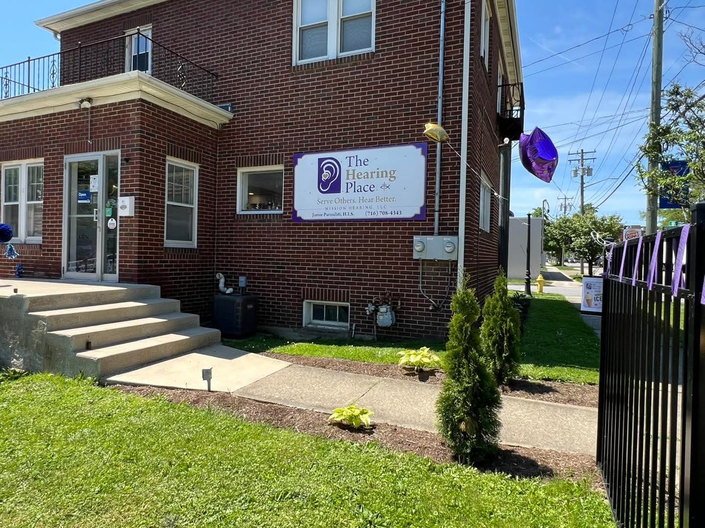 The Hearing Place building and sign on East Main Street, the renovated Falconer, NY home of Mission Hearing, LLC